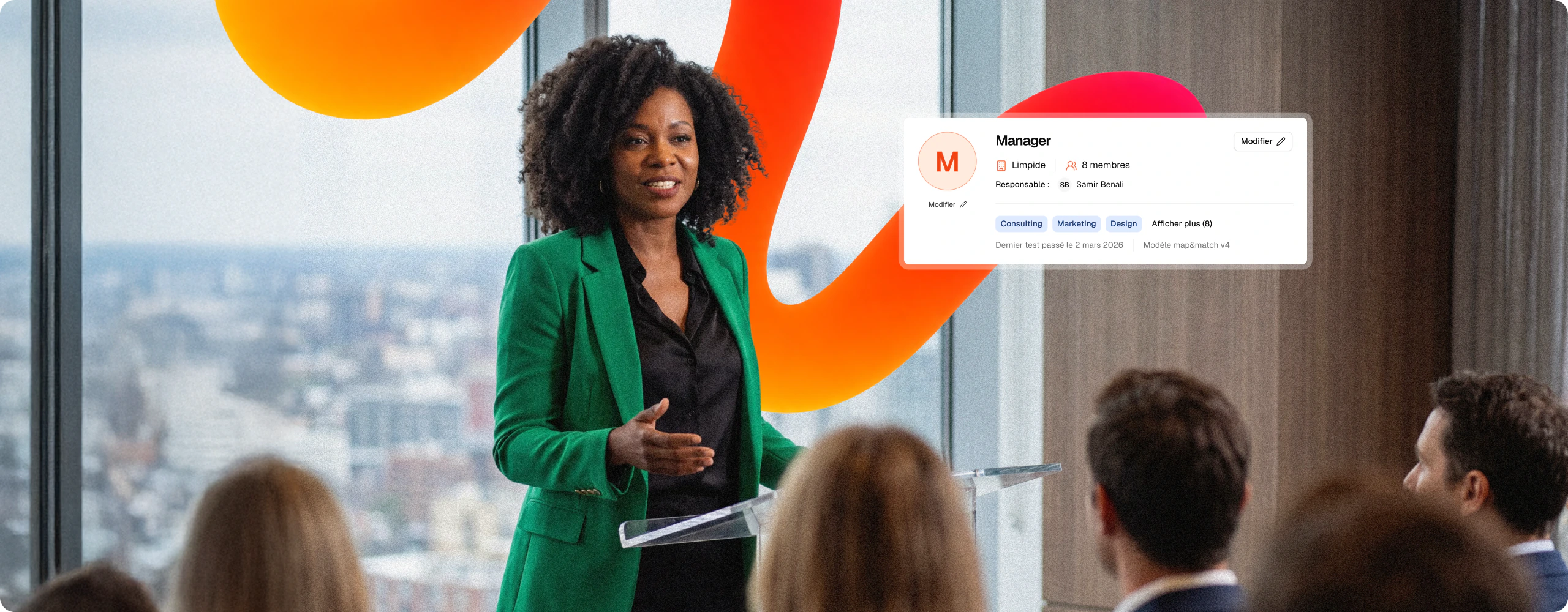 A manager addressing her team, next to her Map & Match profile card